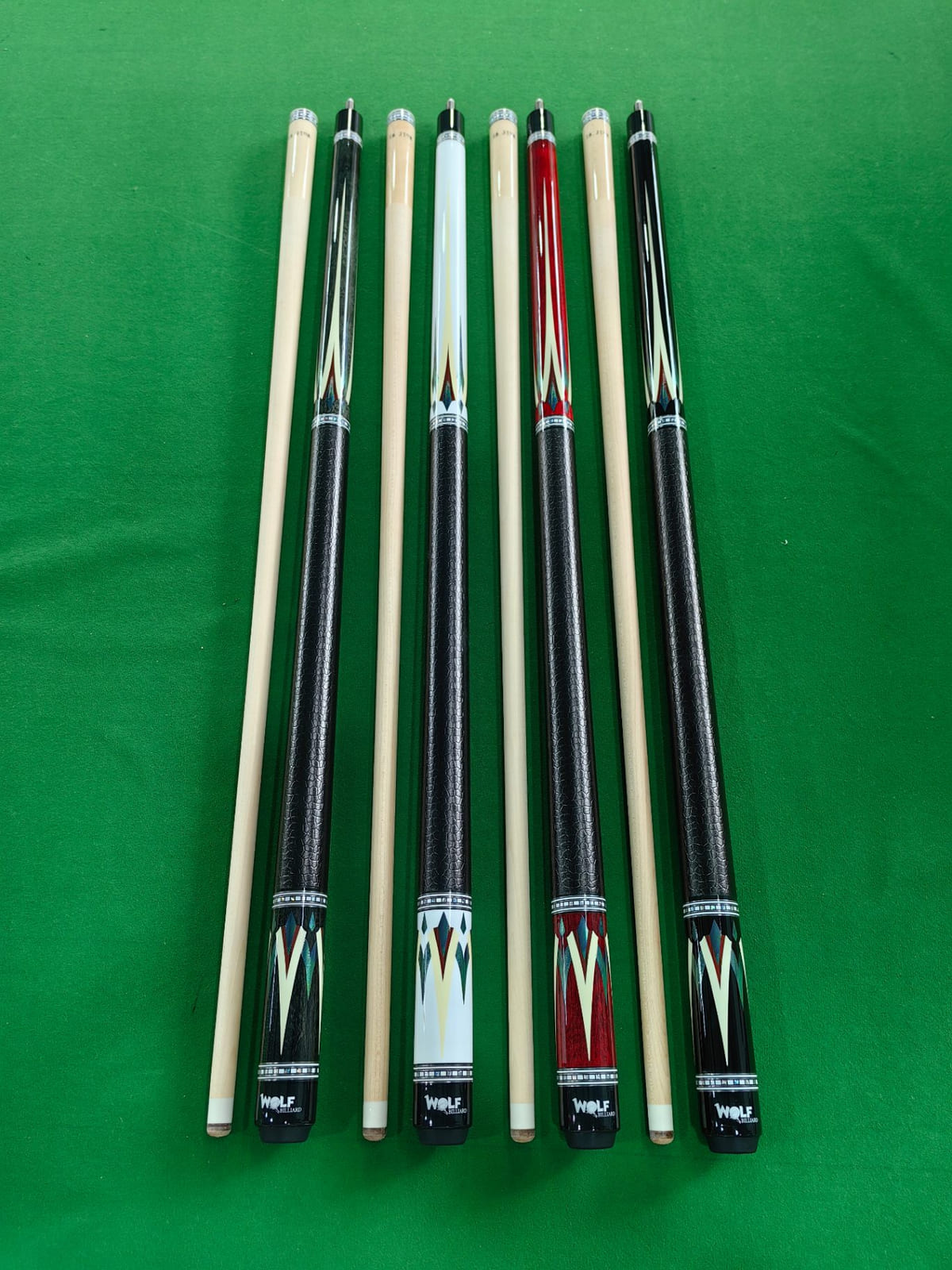 Four-point full-splice cue butts showing the veneer work